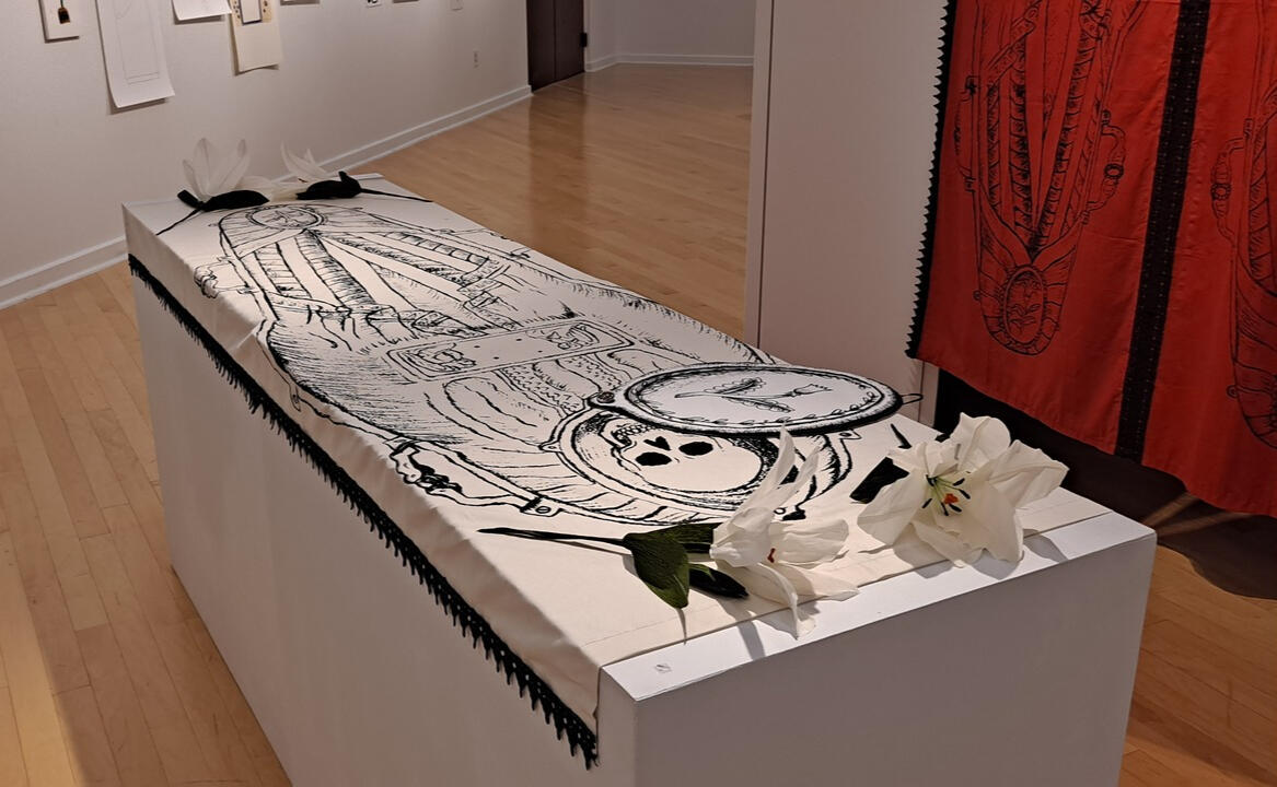 Burial Shroud (in White), Silkscreen prints, acrylic-based ink, lace trim, perfume oil, felt, cardboard, ribbon, and antique Victorian era buttons on cotton. White crepe lilies created by my mother.